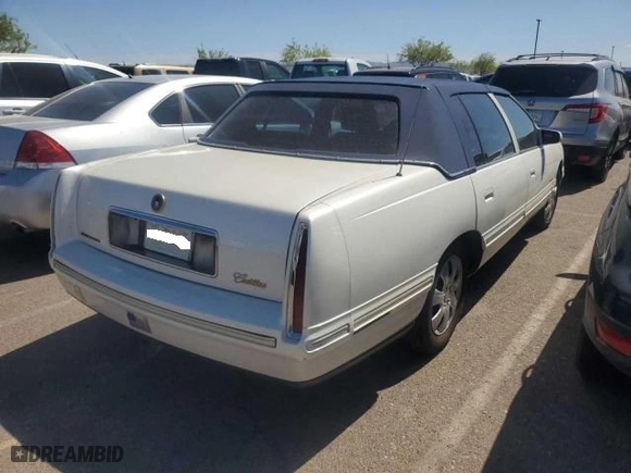 1997 Cadillac DeVille with VIN 1G6KD54Y8VU256755, listed as a Copart auction lot 77669854 with 153,808 mi miles and Clean Title. Bid and sale history available at carsss.com. Image 4.