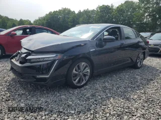 2018 Honda Clarity Touring z VIN JHMZC5F31JC020057, wystawiony jako Copart lot #59752505 z przebiegiem 107 927 mil mil oraz Szkoda całkowita • Salvage title. Historia ofert i sprzedaży dostępna na DreamBid. Obrazek 1.