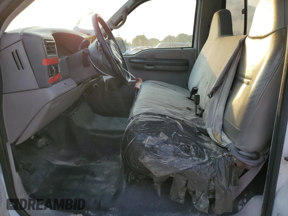 2000 Ford Super Duty F-250 XL with VIN 1FTNF21F7YEA97991, listed as a Copart auction lot 54577544 with 82,036 mi miles and Salvage Title. Bid and sale history available at carsss.com. Image 7.