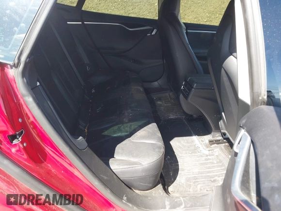 2014 Tesla Model S 60 with VIN 5YJSA1H11EFP37791, listed as a IAAI auction lot 41995504 with 84,371 mi miles and . Bid and sale history available at DreamBid. Image 8.