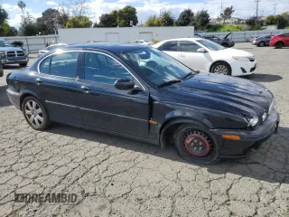 2004 Jaguar X-Type with VIN SAJEA51C74WD56736, listed as a Copart auction lot 48038295 with 115,817 mi miles and Salvage Title. Bid and sale history available at DreamBid. Image 4.