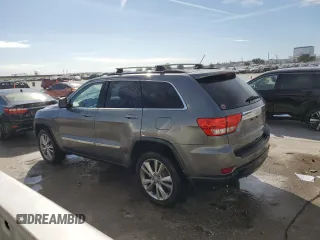 2012 Jeep Grand Cherokee Laredo with VIN 1C4RJEAG1CC306950, listed as a Copart auction lot 84912434 with 128,659 mi miles and Salvage Title. Bid and sale history available at carsss.com. Image 2.