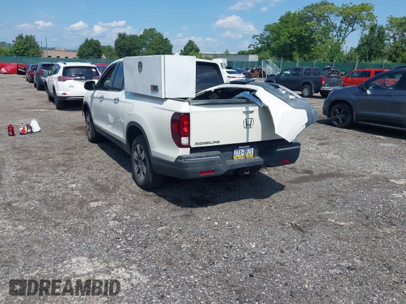 2019 Honda Ridgeline RTL-E with VIN 5FPYK3F71KB017906, listed as a IAAI auction lot 42670476 with 58,288 mi miles and . Bid and sale history available at DreamBid. Image 3.