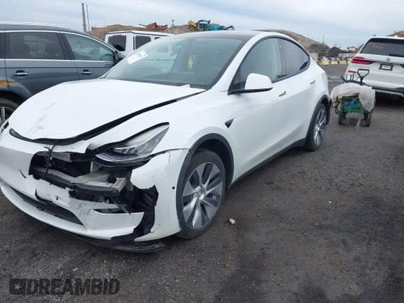 2022 Tesla Model Y Long Range z VIN 7SAYGDEE7NF389788, wystawiony jako IAAI lot #42014111 z przebiegiem 37 606 mil mil oraz . Historia ofert i sprzedaży dostępna na DreamBid. Obrazek 22.
