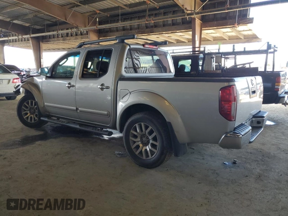 2009 Nissan Frontier SE with VIN 1N6AD07U69C403815, listed as a Copart auction lot 49161015 with 181,843 mi miles and Salvage title. Bid and sale history available at DreamBid. Image 2.