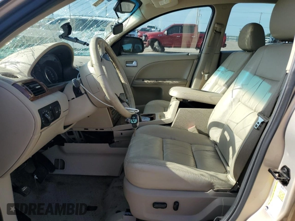 2007 Ford Five Hundred SEL z VIN 1FAFP24117G111409, wystawiony jako Copart lot #61403575 z przebiegiem Nie podano mil oraz Szkoda całkowita • Salvage title. Historia ofert i sprzedaży dostępna na DreamBid. Obrazek 7.