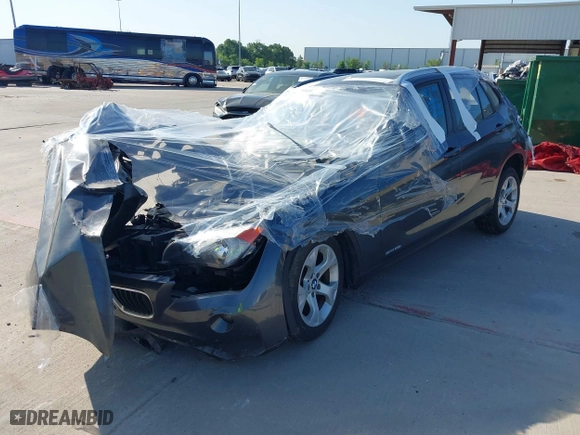 2014 BMW X1 sDrive28i with VIN WBAVM1C53EVW48026, listed as a IAAI auction lot 41714732 with 1 mi miles. Bid and sale history available at carsss.com. Image 2.