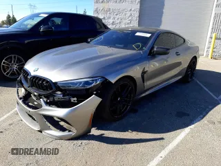 2022 BMW M8 Competition with VIN WBSAE0C02NCG99859, listed as a Copart auction lot 70144082 with 13,504 mi miles. Bid and sale history available at carsss.com. Image 1.