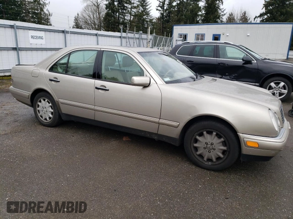 1999 Mercedes-Benz E-Class with VIN WDBJF82H2XX015586, listed as a Copart auction lot 44465455 with 76,890 mi miles and Salvage Title. Bid and sale history available at carsss.com. Image 4.