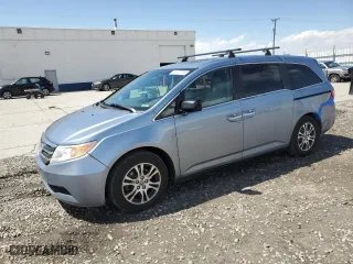 2012 Honda Odyssey EX-L with VIN 5FNRL5H6XCB041293, listed as a Copart auction lot 51707715 with 147,322 mi miles and Salvage Title. Bid and sale history available at carsss.com. Image 1.