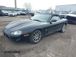 1997 Jaguar XK with VIN SAJGX274XVC017622, listed as a IAAI auction lot 41614339 with 94,298 mi miles and . Bid and sale history available at DreamBid. Image 16.