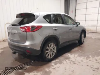 2015 Mazda CX-5 Grand Touring with VIN JM3KE4DY2F0477966, listed as a IAAI auction lot 41247178 with 116,582 mi miles. Bid and sale history available at carsss.com. Image 4.