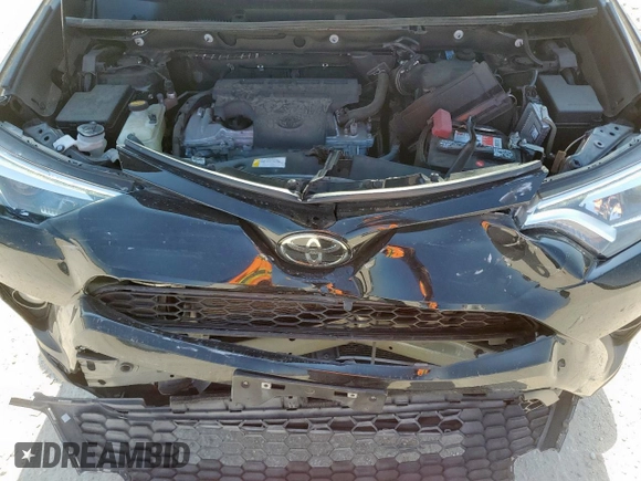 2018 Toyota RAV4 SE with VIN 2T3NFREV6JW436488, listed as a Copart auction lot 60297905 with 74,034 mi miles and Salvage title. Bid and sale history available at DreamBid. Image 12.