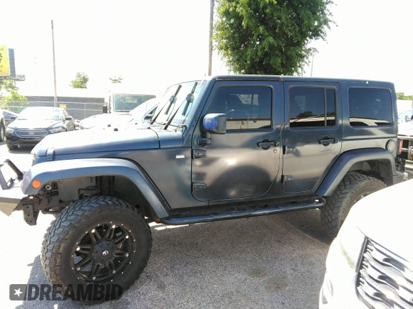 2013 Jeep Wrangler Unlimited Sport z VIN 1C4BJWDG1DL660844, wystawiony jako IAAI lot #42347284 z przebiegiem 168 709 mil mil oraz . Historia ofert i sprzedaży dostępna na DreamBid. Obrazek 14.