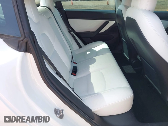 2020 Tesla Model 3 Standard Range Plus with VIN 5YJ3E1EA3LF785951, listed as a IAAI auction lot 41919339 with 63,025 mi miles and . Bid and sale history available at carsss.com. Image 8.