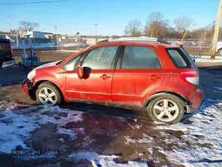 2009 Suzuki SX4 Man Touring Pkg AWD with VIN JS2YB417996202822, listed as a IAAI auction lot 41423724 with 181,531 mi miles. Bid and sale history available at carsss.com. Image 14.