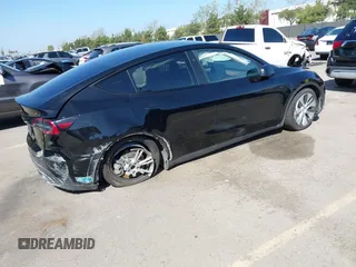 2024 Tesla Model Y Long Range z VIN 7SAYGDEE0RF078242, wystawiony jako IAAI lot #41808826 z przebiegiem 59 581 mil mil oraz . Historia ofert i sprzedaży dostępna na DreamBid. Obrazek 4.