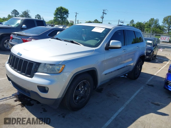 2011 Jeep Grand Cherokee Laredo with VIN 1J4RS4GGXBC513523, listed as a IAAI auction lot 42203802 with 242,239 mi miles and . Bid and sale history available at DreamBid. Image 2.