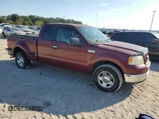 2005 Ford F-150 XLT with VIN 1FTPX02595KF03248, listed as a Copart auction lot 77145414 with 161,783 mi miles and Salvage Title. Bid and sale history available at carsss.com. Image 4.