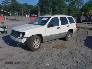 2002 Jeep Grand Cherokee Laredo with VIN 1J4GX48S62C310060, listed as a IAAI auction lot 42546172 with Not provided miles and . Bid and sale history available at DreamBid. Image 2.