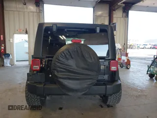 2012 Jeep Wrangler Unlimited Sport with VIN 1C4BJWDG8CL246829, listed as a IAAI auction lot 41816197 with 198,502 mi miles. Bid and sale history available at carsss.com. Image 17.