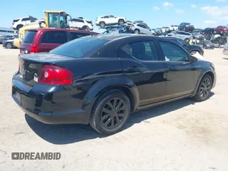 2014 Dodge Avenger SE with VIN 1C3CDZAB1EN133550, listed as a IAAI auction lot 42033001 with 137,592 mi miles. Bid and sale history available at carsss.com. Image 4.