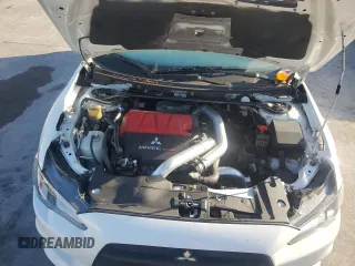 2014 Mitsubishi Lancer Evolution GSR z VIN JA32W8FV5EU023703, wystawiony jako Copart lot #72744504 z przebiegiem Nie podano mil oraz Szkody całkowita. Historia ofert i sprzedaży dostępna na DreamBid. Obrazek 11.