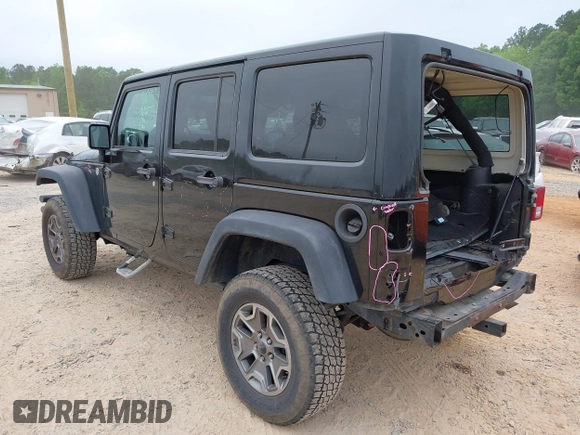 2015 Jeep Wrangler Unlimited Rubicon with VIN 1C4BJWFG7FL688728, listed as a IAAI auction lot 42054304 with 100,152 mi miles and . Bid and sale history available at DreamBid. Image 3.
