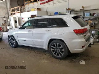 2017 Jeep Grand Cherokee Overland z VIN 1C4RJFCG8HC809868, wystawiony jako Copart lot #64056155 z przebiegiem 54 136 mil mil oraz Szkoda całkowita • Salvage title. Historia ofert i sprzedaży dostępna na DreamBid. Obrazek 2.