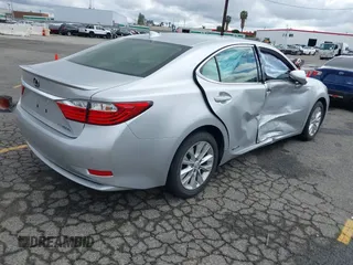 2015 Lexus ES 300h with VIN JTHBW1GG1F2084938, listed as a IAAI auction lot 41761844 with 69,854 mi miles and . Bid and sale history available at DreamBid. Image 4.