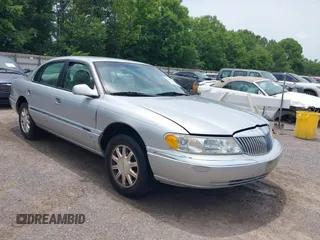 1999 Lincoln Continental z VIN 1LNHM97V7XY607937, wystawiony jako IAAI lot #42473686 z przebiegiem 171 044 mil mil oraz . Historia ofert i sprzedaży dostępna na DreamBid. Obrazek 1.