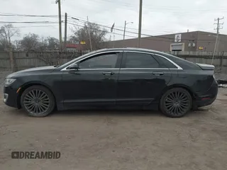2017 Lincoln MKZ Reserve z VIN 3LN6L5E9XHR649804, wystawiony jako IAAI lot #41906488 z przebiegiem 161 150 mil mil oraz . Historia ofert i sprzedaży dostępna na DreamBid. Obrazek 14.