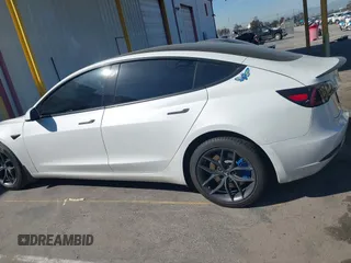 2020 Tesla Model 3 Standard Range Plus with VIN 5YJ3E1EA1LF659765, listed as a IAAI auction lot 41834411 with 42,433 mi miles and . Bid and sale history available at carsss.com. Image 14.