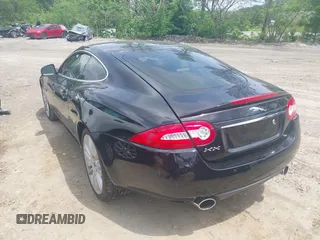 2012 Jaguar XK with VIN SAJWA4FB8CLB47049, listed as a IAAI auction lot 42118136 with 60,953 mi miles. Bid and sale history available at carsss.com. Image 3.