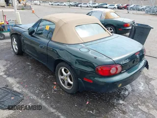 2002 Mazda MX-5 Miata Cloth z VIN JM1NB353720222073, wystawiony jako IAAI lot #42225042 z przebiegiem 94 992 mil mil oraz . Historia ofert i sprzedaży dostępna na DreamBid. Obrazek 3.