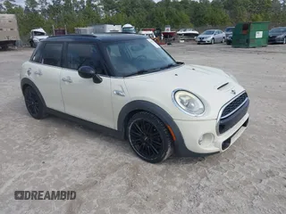 2017 MINI Hardtop 4 Door Cooper S z VIN WMWXU3C54H2D32602, wystawiony jako IAAI lot #41458333 z przebiegiem 124 235 mil mil oraz . Historia ofert i sprzedaży dostępna na DreamBid. Obrazek 1.
