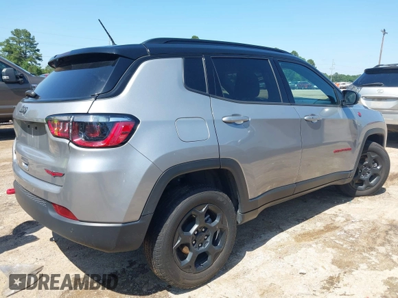 2023 Jeep Compass Trailhawk with VIN 3C4NJDDN3PT527995, listed as a IAAI auction lot 42218464 with 47,701 mi miles and . Bid and sale history available at DreamBid. Image 4.