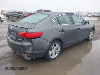 2014 Acura ILX Hybrid Technology z VIN 19VDE3F75EE300312, wystawiony jako IAAI lot #41608572 z przebiegiem 126 974 mil mil oraz . Historia ofert i sprzedaży dostępna na DreamBid. Obrazek 4.