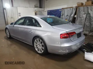 2015 Audi A8 with VIN WAUJGAFD1FN011100, listed as a Copart auction lot 49166055 with 38,575 mi miles and Salvage title. Bid and sale history available at DreamBid. Image 2.