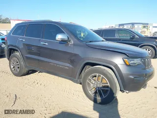 2019 Jeep Grand Cherokee Limited with VIN 1C4RJEBG4KC698111, listed as a IAAI auction lot 41523077 with 128,887 mi miles. Bid and sale history available at carsss.com. Image 1.