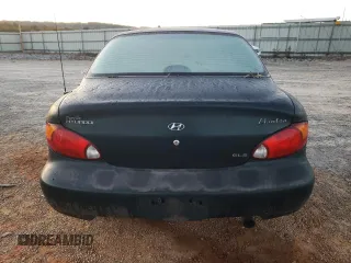 2000 Hyundai Elantra GLS z VIN KMHJF35F6YU890800, wystawiony jako Copart lot #76972294 z przebiegiem 159 134 mil mil oraz Szkoda całkowita • Salvage title. Historia ofert i sprzedaży dostępna na DreamBid. Obrazek 6.