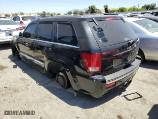 2007 Jeep Grand Cherokee SRT-8 with VIN 1J8HR78387C603473, listed as a Copart auction lot 57712964 with 114,429 mi miles and Salvage Title. Bid and sale history available at carsss.com. Image 2.