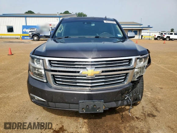 2015 Chevrolet Tahoe LTZ z VIN 1GNSCCKC8FR102859, wystawiony jako Copart lot #56755555 z przebiegiem 167 191 mil mil oraz Czysty tytuł • Clean title. Historia ofert i sprzedaży dostępna na DreamBid. Obrazek 5.