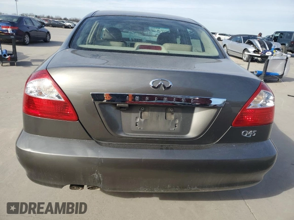 2004 Infiniti Q45 z VIN JNKBF01AX4M500632, wystawiony jako Copart lot #87741405 z przebiegiem 188 505 mil mil oraz Szkoda całkowita • Salvage title. Historia ofert i sprzedaży dostępna na DreamBid. Obrazek 6.
