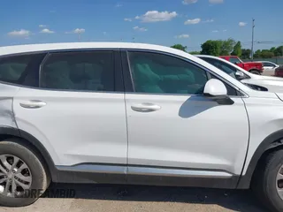 2019 Hyundai Santa Fe SE with VIN 5NMS23AD8KH051223, listed as a IAAI auction lot 42017754 with 146,704 mi miles and . Bid and sale history available at DreamBid. Image 12.