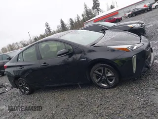 2022 Toyota Prius L Eco with VIN JTDKAMFU2N3154674, listed as a IAAI auction lot 41977505 with 61,552 mi miles and . Bid and sale history available at DreamBid. Image 14.