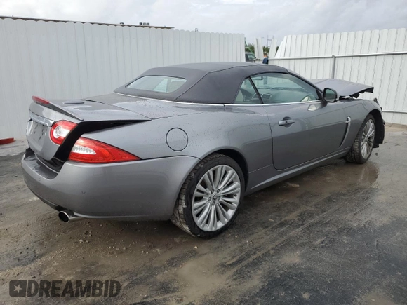 2010 Jaguar XK with VIN SAJWA4GB4ALB37114, listed as a Copart auction lot 77673824 with 99,999 mi miles and Salvage Title. Bid and sale history available at carsss.com. Image 3.