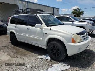 2004 Suzuki XL7 LX with VIN JS3TX92V444107106, listed as a Copart auction lot 62322035 with 94,380 mi miles and Salvage title. Bid and sale history available at DreamBid. Image 4.