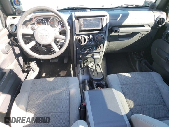 2007 Jeep Wrangler Unlimited Sahara with VIN 1J4GA59197L141821, listed as a Copart auction lot 76897044 with 124,070 mi miles and Salvage title. Bid and sale history available at DreamBid. Image 8.