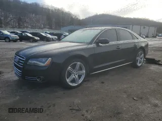2013 Audi A8 3.0L with VIN WAUAGAFDXDN000657, listed as a Copart auction lot 42992755 with 154,426 mi miles and Salvage title. Bid and sale history available at DreamBid. Image 1.